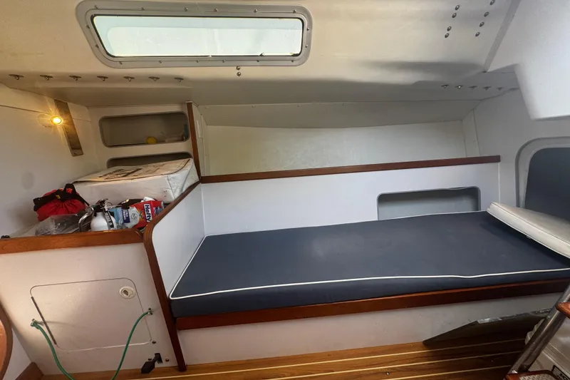 Slide: The Image of Interior cabin of a 2003 J Boats J/105 sailboat with sleeping berth and storage. - 18