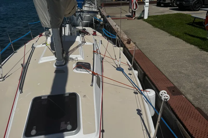 Slide: The Image of 2003 J Boats J/105 sailboat docked, showing deck and rigging details. - 4