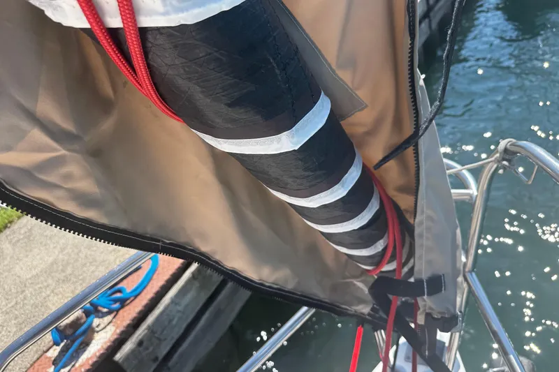 Slide: The Image of Close-up of a 2003 J Boats J/105 sailboat mast with red and black rigging. - 9