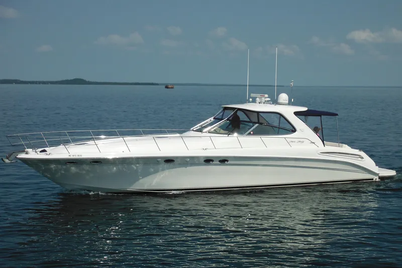 Slide: The Image of 2001 Sea Ray 540 Sundancer yacht cruising on calm waters. - 0