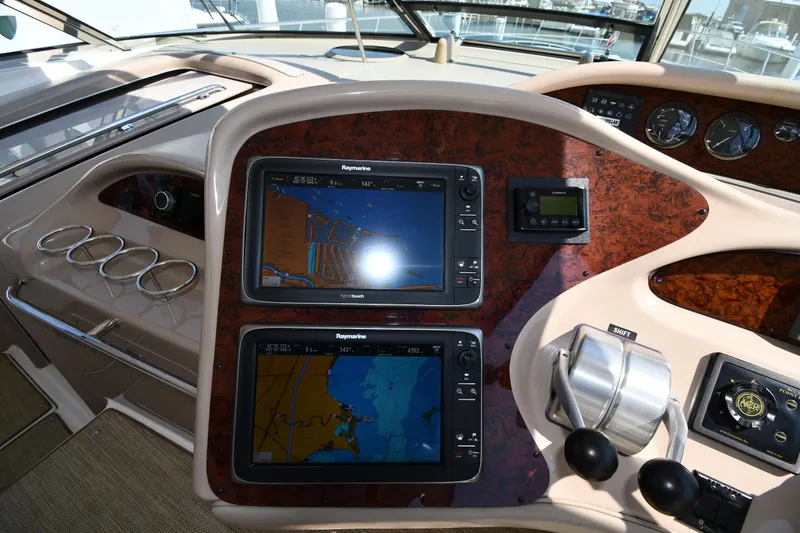 Slide: The Image of Control panel of 2001 Sea Ray 540 Sundancer with navigation screens and controls. - 13
