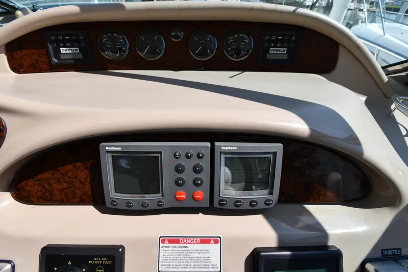 Slide: The Image of Control panel of a 2001 Sea Ray 540 Sundancer yacht with navigation instruments. - 14