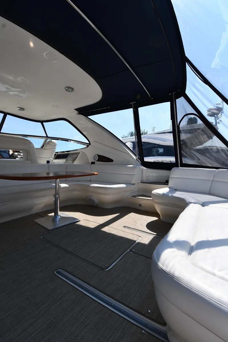 Slide: The Image of Interior of 2001 Sea Ray 540 Sundancer yacht, featuring spacious seating and elegant design. - 20
