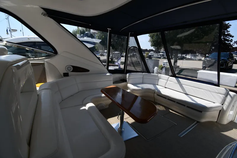 Slide: The Image of Luxurious interior of 2001 Sea Ray 540 Sundancer yacht with elegant seating and table. - 23