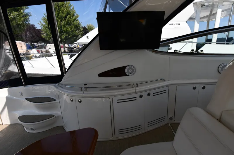 Slide: The Image of Interior of 2001 Sea Ray 540 Sundancer yacht with sleek cabinetry and mounted TV. - 28