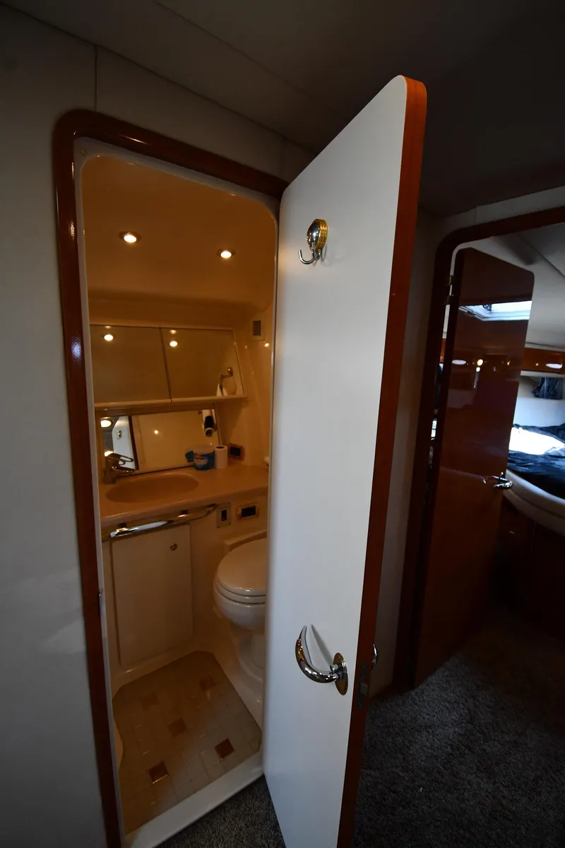 Slide: The Image of 2001 Sea Ray 540 Sundancer yacht bathroom interior with modern fixtures and lighting. - 42