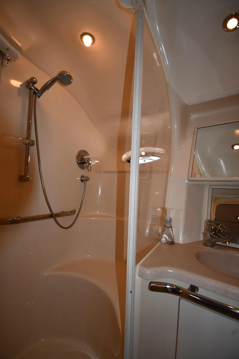 Slide: The Image of 2001 Sea Ray 540 Sundancer bathroom with shower and sink. - 44
