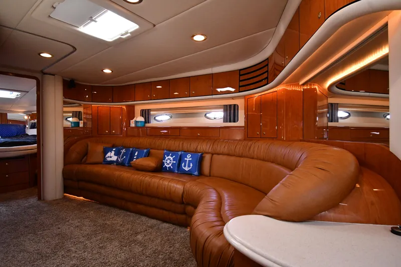 Slide: The Image of Luxurious interior of 2001 Sea Ray 540 Sundancer yacht with plush seating and nautical decor. - 45
