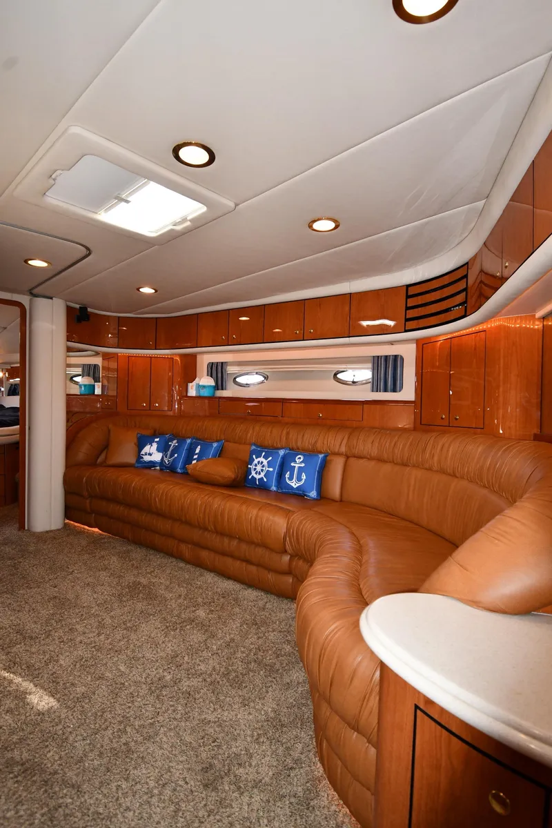 Slide: The Image of Luxurious interior of 2001 Sea Ray 540 Sundancer yacht with leather seating and nautical decor. - 46
