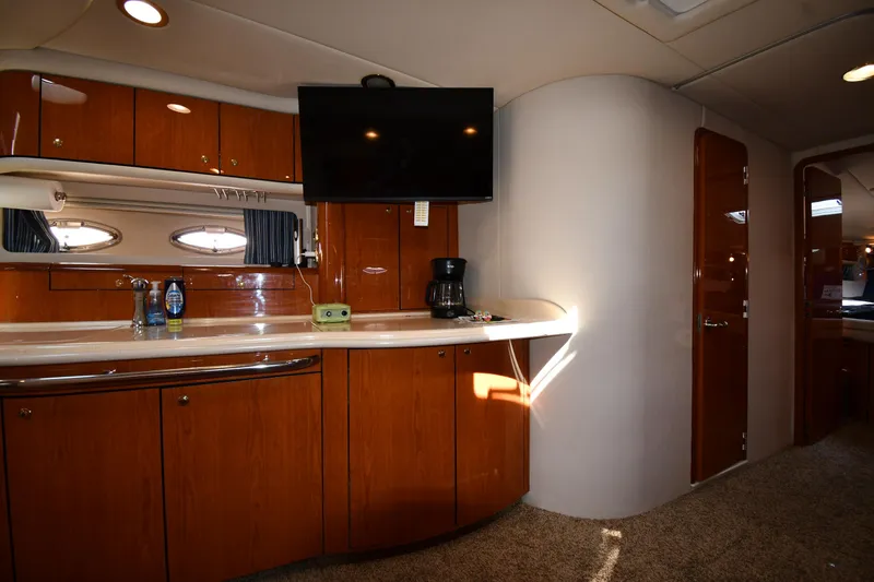 Slide: The Image of Interior of 2001 Sea Ray 540 Sundancer yacht with wooden cabinetry and modern amenities. - 47