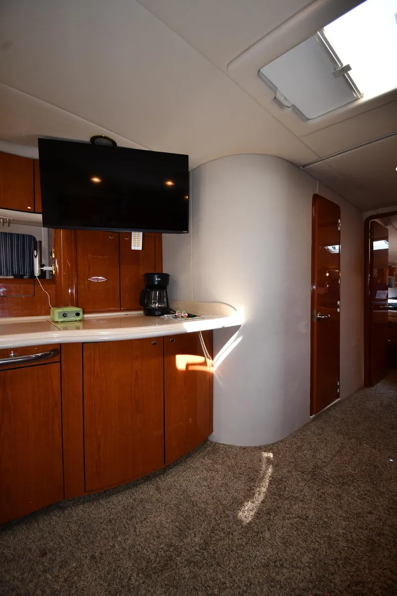 Slide: The Image of Interior of 2001 Sea Ray 540 Sundancer yacht with TV and kitchenette. - 48