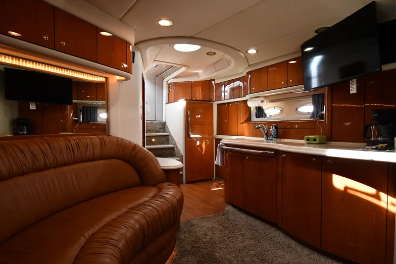 Slide: The Image of Luxurious interior of 2001 Sea Ray 540 Sundancer yacht with leather seating and modern amenities. - 49