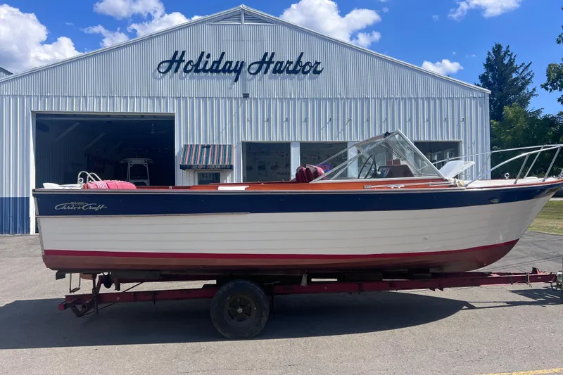 The Image of 1964 Chris Craft Sea Skiff Sportsman boat on trailer at Holiday Harbor. - 0