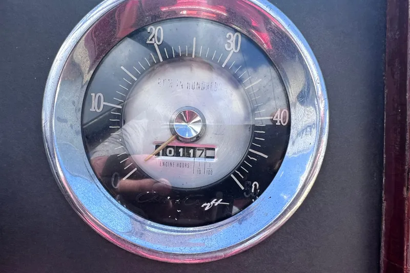 Slide: The Image of 1964 Chris Craft Sea Skiff Sportsman engine hour gauge, showing 1017 hours. - 13