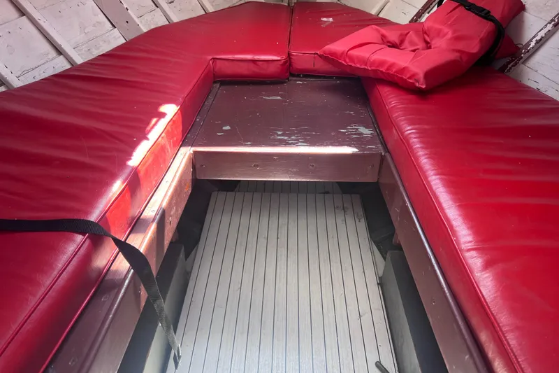 Slide: The Image of 1964 Chris Craft Sea Skiff Sportsman interior with red cushioned seating. - 15
