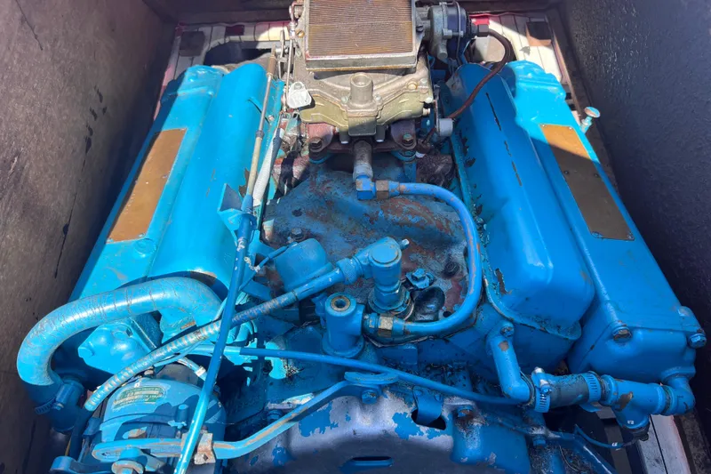 Slide: The Image of 1964 Chris Craft Sea Skiff Sportsman engine, vibrant blue, detailed view. - 17