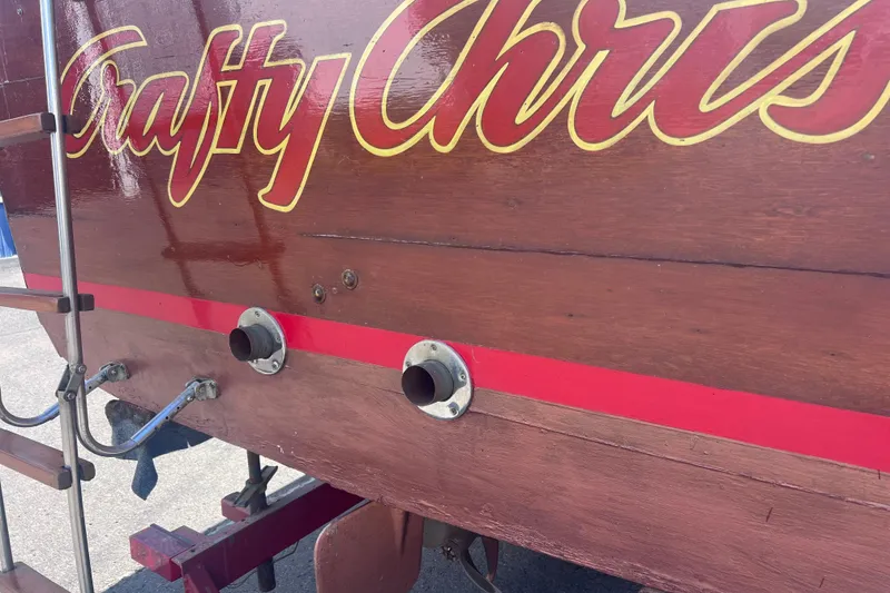 Slide: The Image of 1964 Chris Craft Sea Skiff Sportsman boat with wooden hull and decorative lettering. - 6