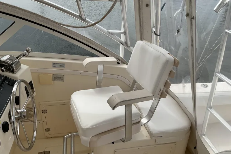 Slide: The Image of Captain's chair and helm of 2003 Albemarle 27 Express Fisherman boat. - 12