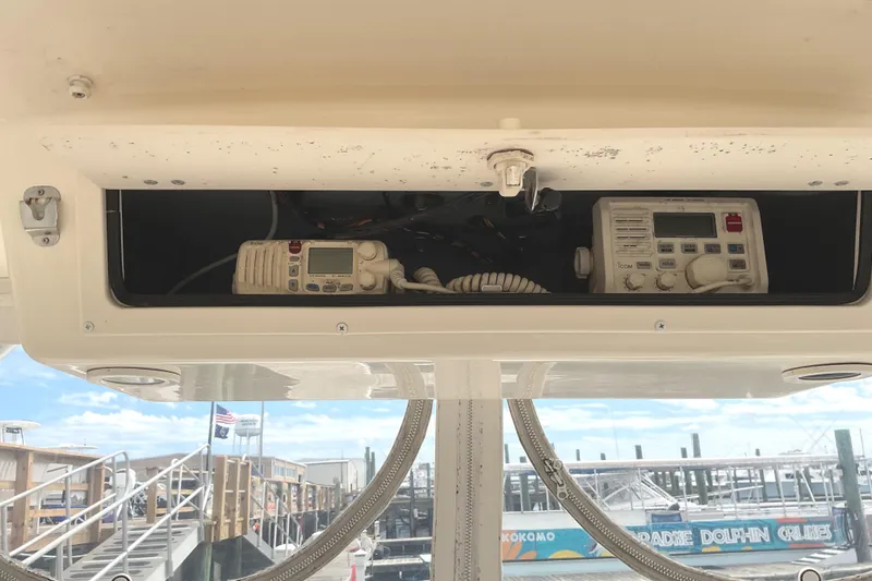 Slide: The Image of 2003 Albemarle 27 Express Fisherman boat electronics compartment with communication devices. - 15