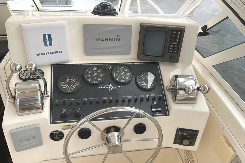 Slide: The Image of Control panel of a 2003 Albemarle 27 Express Fisherman boat with Garmin and Furuno equipment. - 16