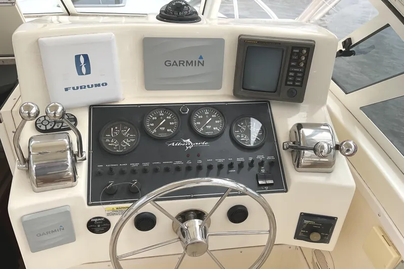 Slide: The Image of Control panel of a 2003 Albemarle 27 Express Fisherman boat with navigation instruments. - 18