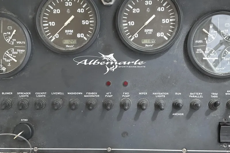 Slide: The Image of Dashboard of a 2003 Albemarle 27 Express Fisherman boat with gauges and switches. - 19