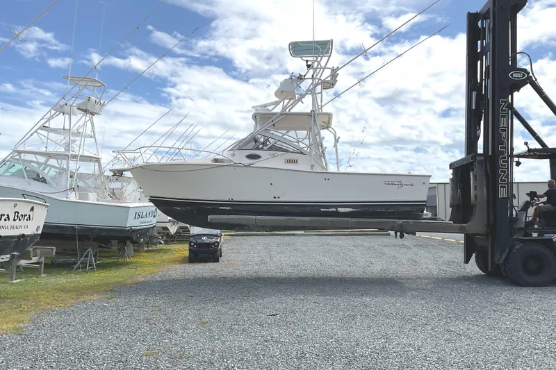 Slide: The Image of 2003 Albemarle 27 Express Fisherman boat lifted by forklift in a boatyard. - 32