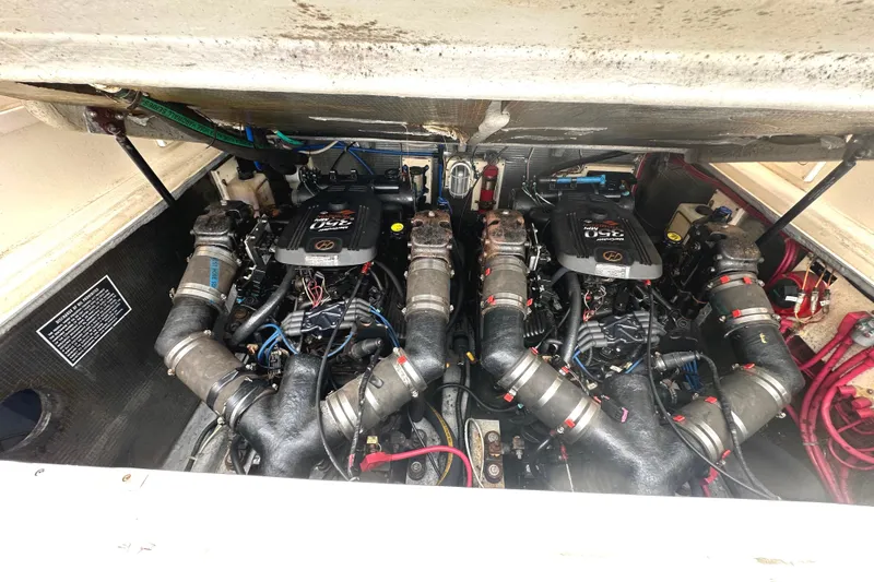 Slide: The Image of Engine compartment of a 2003 Albemarle 27 Express Fisherman boat, showcasing dual engines. - 8