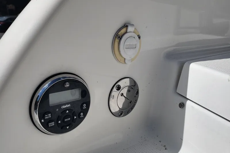 Slide: The Image of Control panel of a 2015 Formula 240 Bowrider boat with Clarion audio system. - 11