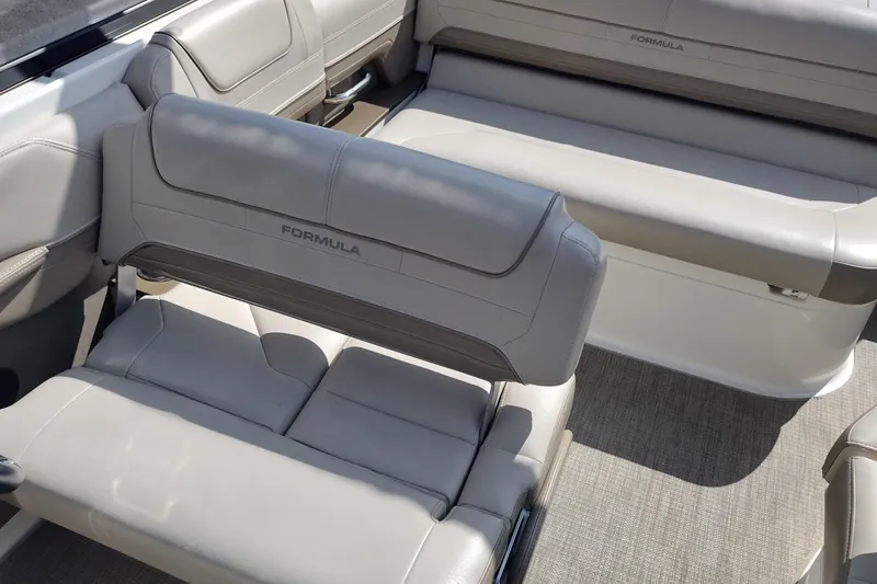 Slide: The Image of 2015 Formula 240 Bowrider interior with beige leather seating and spacious layout. - 17