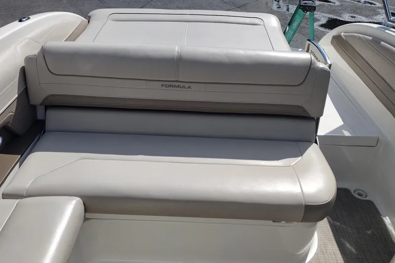 Slide: The Image of 2015 Formula 240 Bowrider boat with beige leather seating, rear view. - 21