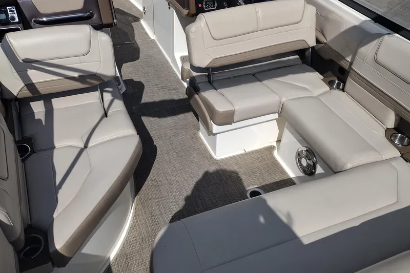Slide: The Image of 2015 Formula 240 Bowrider interior with beige seating and cup holders. - 22