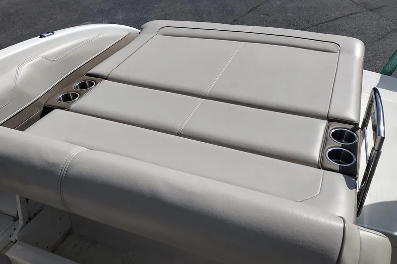 Slide: The Image of 2015 Formula 240 Bowrider boat with beige leather seating and built-in cup holders. - 26