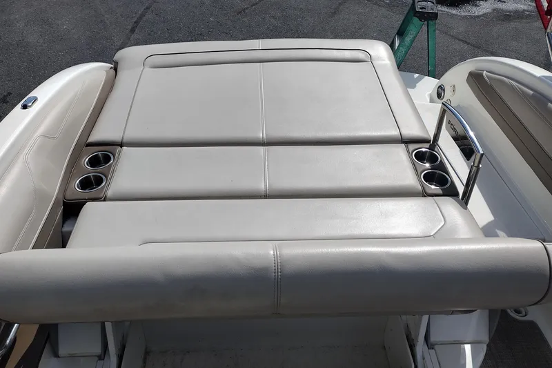 Slide: The Image of 2015 Formula 240 Bowrider boat with beige seating and cup holders. - 28