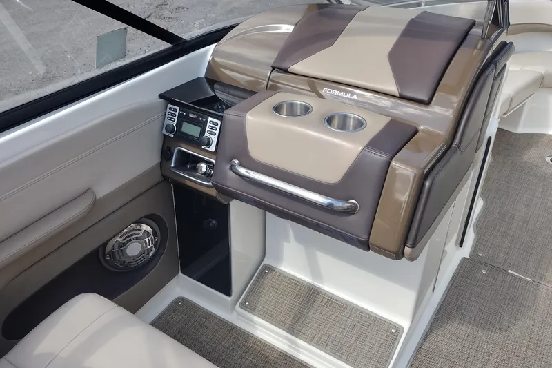 Slide: The Image of 2015 Formula 240 Bowrider interior with control panel and cup holders. - 30