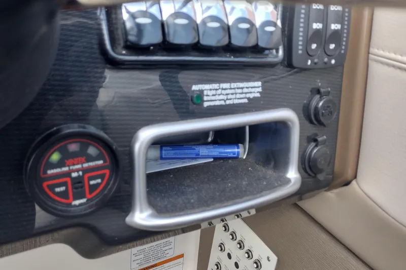 Slide: The Image of Control panel of a 2015 Formula 240 Bowrider boat with various switches and gauges. - 33