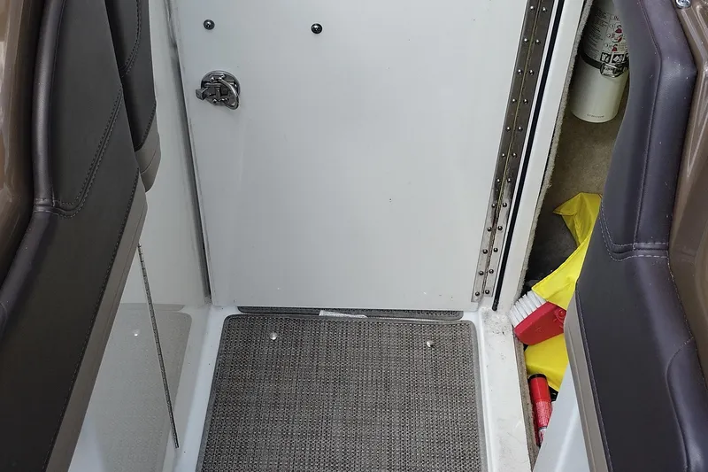 Slide: The Image of Interior view of a 2015 Formula 240 Bowrider boat with storage compartment. - 36