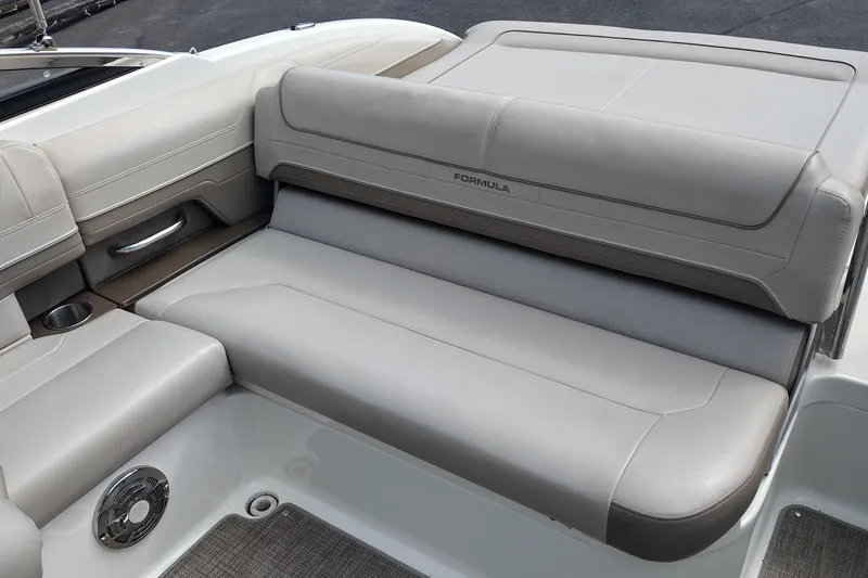 Slide: The Image of 2015 Formula 240 Bowrider boat interior with beige seating and cup holder. - 38