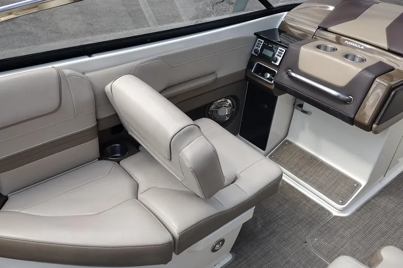 Slide: The Image of 2015 Formula 240 Bowrider interior with beige seating and modern dashboard design. - 39