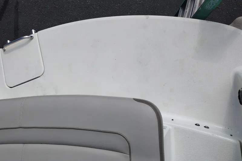 Slide: The Image of 2015 Formula 240 Bowrider boat interior with gray seating and white deck. - 41