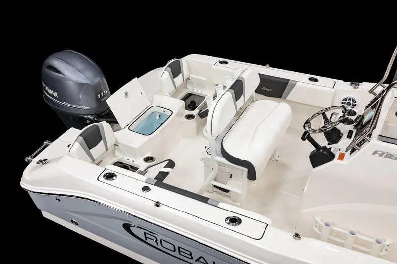 Slide: The Image of 2026 Robalo R180 Center Console boat interior with Yamaha engine, featuring seating and steering console. - 12