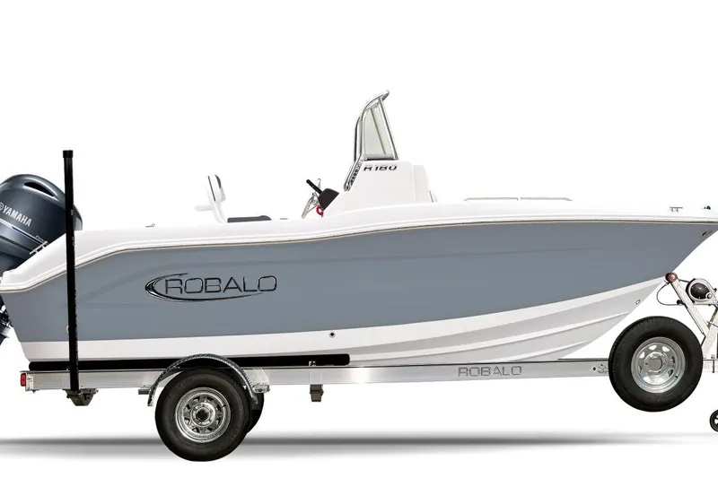 Slide: The Image of 2026 Robalo R180 Center Console boat on trailer, side view. - 3