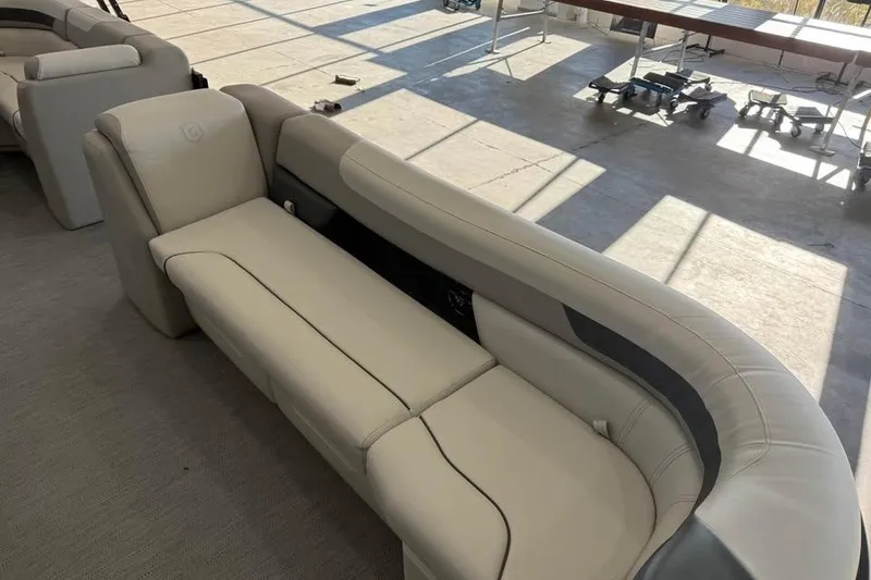 Slide: The Image of Luxurious seating on 2026 Godfrey Sweetwater 2286 C pontoon boat, featuring elegant beige upholstery. - 6