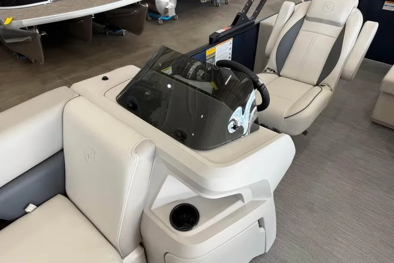 Slide: The Image of 2026 Godfrey Sweetwater 2286 C boat interior with sleek helm and comfortable seating. - 7