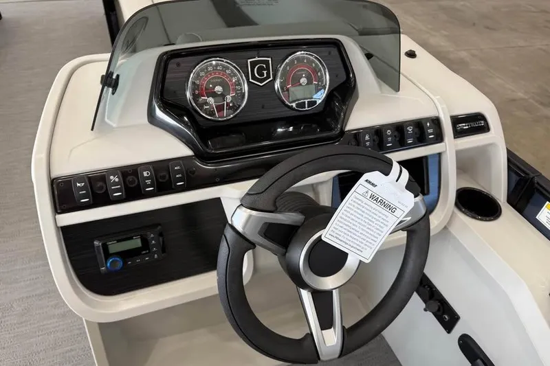 Slide: The Image of 2026 Godfrey Sweetwater 2286 C dashboard with steering wheel and control panel. - 8