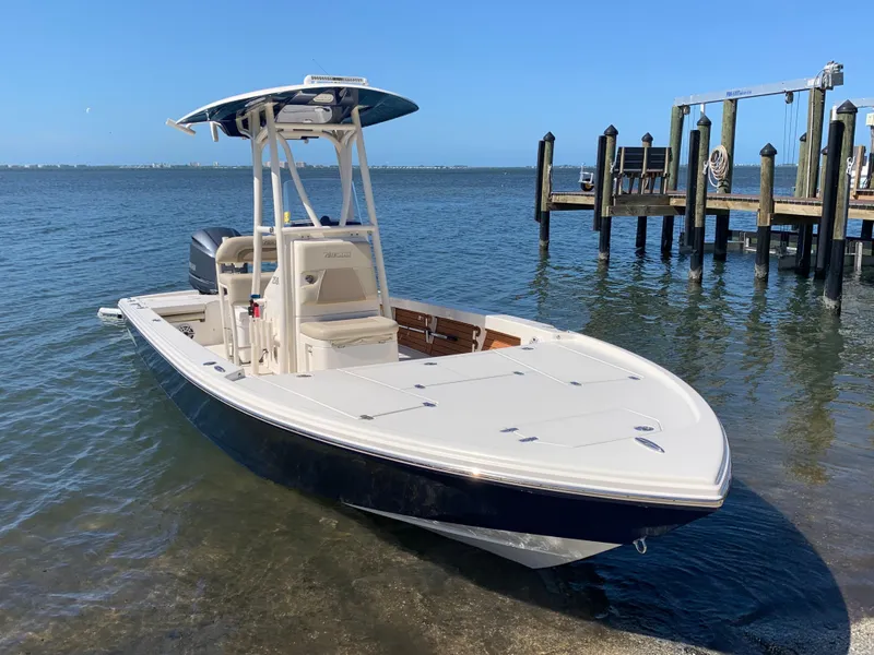 Slide: The Image of 2017 Pathfinder 2500 Hybrid boat docked by the shore on a sunny day. - 19
