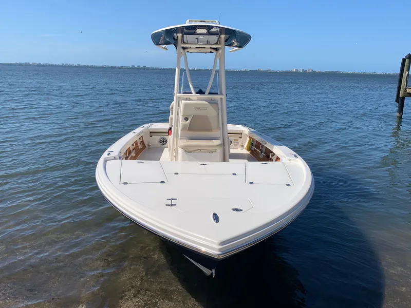 Slide: The Image of 2017 Pathfinder 2500 Hybrid boat docked by the shore on a sunny day. - 20