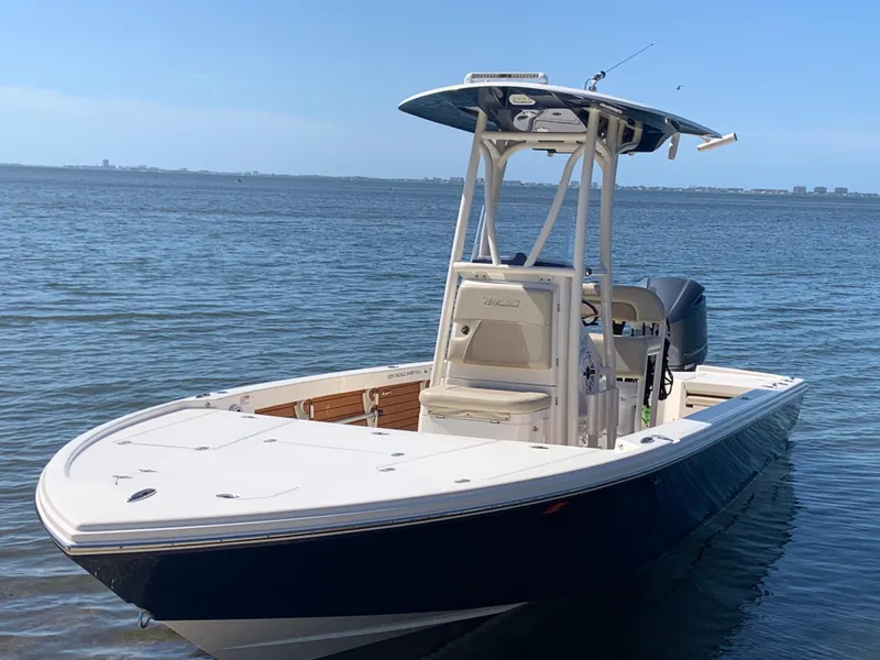 Slide: The Image of 2017 Pathfinder 2500 Hybrid boat on calm water, front view. - 21