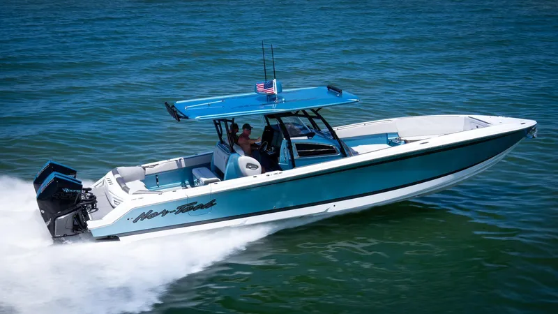 The Image of 2021 Nor-Tech 390 Sport Center Console boat cruising on open water. - 0