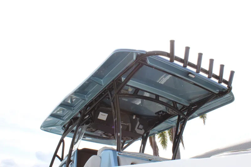 Slide: The Image of 2021 Nor-Tech 390 Sport Center Console boat with sleek blue T-top design. - 27
